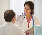 Woman doctor talking to a patient
