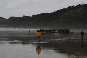 "Floating dock washes up on the Oregon coast."
