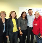 Staff members attend a ribbon-cutting ceremony at the Lawrence Senior Center