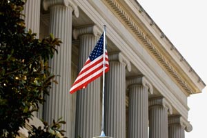 Building with American flag in front.