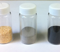 Vials containing sawdust, catalyst, charred catalyst and gasoline made from sawdust.