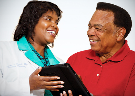 Dr. Karen Smith and her patient, Donald Jones, use electronic health records to help manage his diabetes.