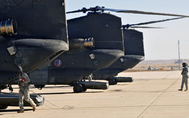 The 4th Combat Aviation Brigade, 4th Infantry Division, receives the unit's first CH-47 Chinook helicopters at Butts Army Airfield on Fort Carson, Colo., Jan. 22, 2013. Crew members conduct their post flight checks. The Chinooks are the first CH-47s to arrive to the new combat aviation brigade.