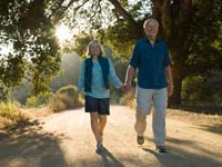 Photo: Older couple walking holding hands