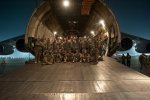 Soldiers from 101st Combat Aviation Brigade, Task Force Destiny, pose in the mouth of...