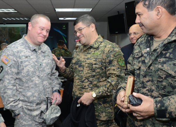 Brig Gen. William L. Smith (left), the commander DOMOPS for the Texas Military Forces, shares a laugh with Salvadoran Brig. Gen. Rafael Melara, the chief of staff of the Salvadoran army, and Honduran Brig. Gen. Freddy Santiago Diaz, the commander of the Honduran army, during a Central American Regional Leaders Conference visit to Camp Mabry, Texas, Jan. 30, 2013.