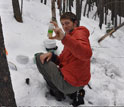 Researcher T. Joe Mills samples winter snows in the Boulder Creek watershed.