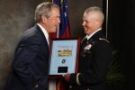 Wounded warrior presents former president with Infantry Silver Dollar