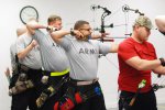 Army Warrior Games athletes compete during archery, sitting volleyball trials