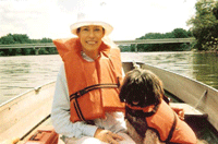 Photo of woman and dog in a boat