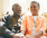 Image of older African-American couple sitting on sofa