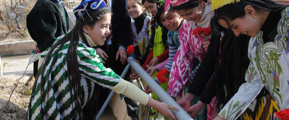 These girls are some of the nearly 100,000 people in Tajikistan who have gained access to clean water