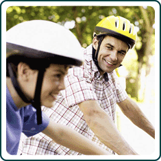 A couple riding their bikes.