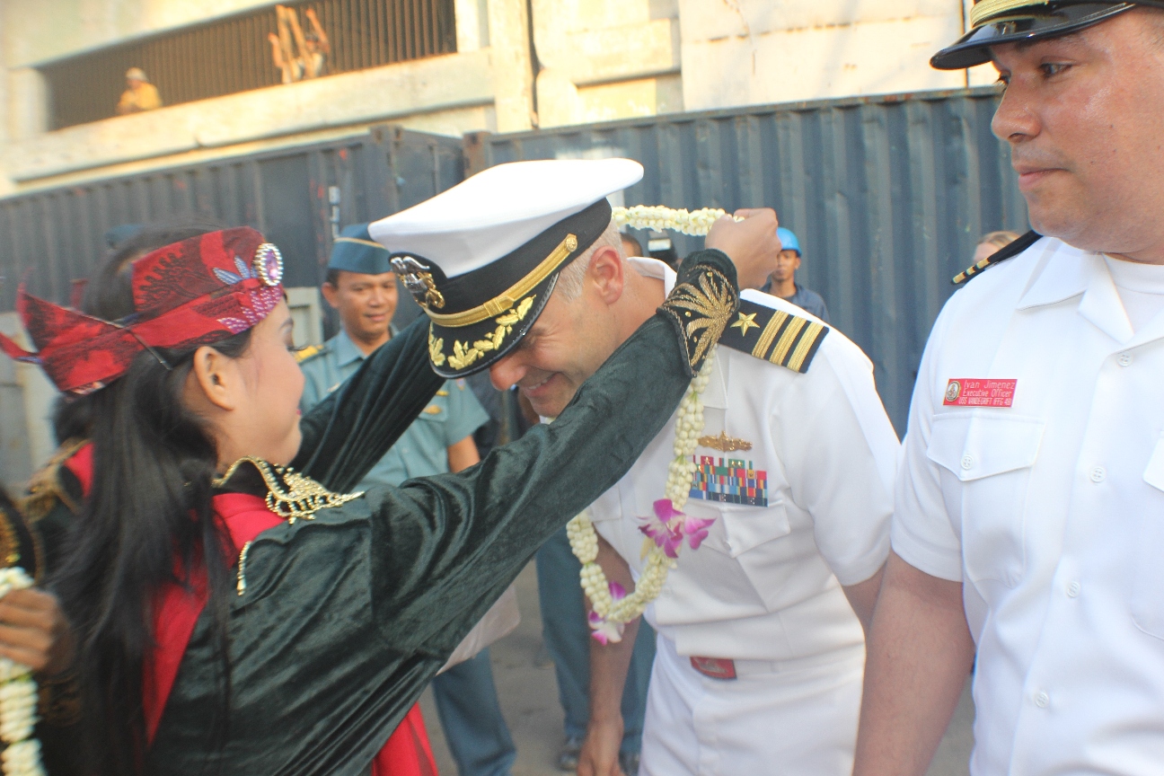 USS VANDEGRIFT’s Commanding Officer CDR Brandon Bryan is greeted by Rainbow Dancers 