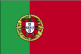 Flag of Portugal is two vertical bands of green--hoist side, two-fifths--and red--three-fifths--with the Portuguese coat of arms centered on the dividing line. 2004.