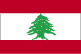 Flag of Lebanon is three horizontal bands of red at top, double width white, and red with a green cedar tree centered in the white band. 2004.
