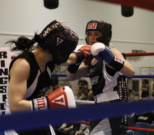 The West Point Women's Boxing Club presented a phenomenal inaugural invitational despite the massive winter snowstorm that prevented many of the registered boxers from competing ,Feb. 9, 2013. Still, the 2013 West Point Women's Boxing Invitational featured 12 bouts at the North End Boxing Room in the Arvin Cadet Physical Development Center, at the U.S. Military Academy at West Point, N.Y., in front of many family members, friends, colleagues and community members. Pictured is Class of 2015 Cadet Victoria Rao boxing against an opponent from the University of San Francisco.