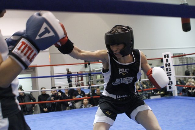 Class of 2013 Cadet Giovanna Camacho fights the final bout at the 2013 West Point Women's Boxing Invitational Feb. 9, 2013, at the U.S. Military Academy at West Point, N.Y. As the West Point Women's Boxing Club captain and only senior member, Camacho has been involved since her freshman year in its development from a hobby sport into a competitive club.
