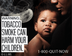 Text: WARNING: Tobacco smoke can harm your children. Image: Baby in woman’s arms, with smoke approaching baby. Cessation Resource: 1-800-QUIT-NOW Copyright: U.S. HHS