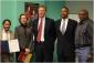 IMG: Mayor Christopher B. Coleman and project members celebrate at an Open House