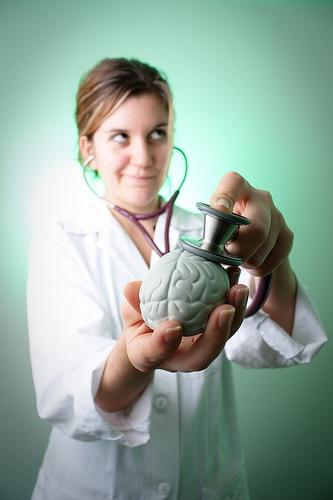 Doctor holding brain.