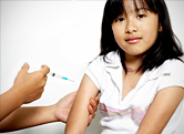 A young child receives a vaccination.