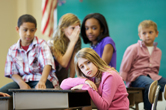 A young girl is bullied by her peers