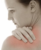 Woman rubs shoulder in pain