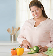 Image of young woman preparing healthy food
