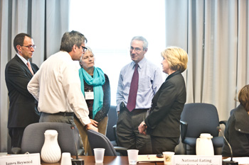 Alliance members conversing at February 2012 meeting