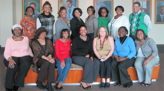 Fifteen Atlanta Champions pose together, seated and standing.