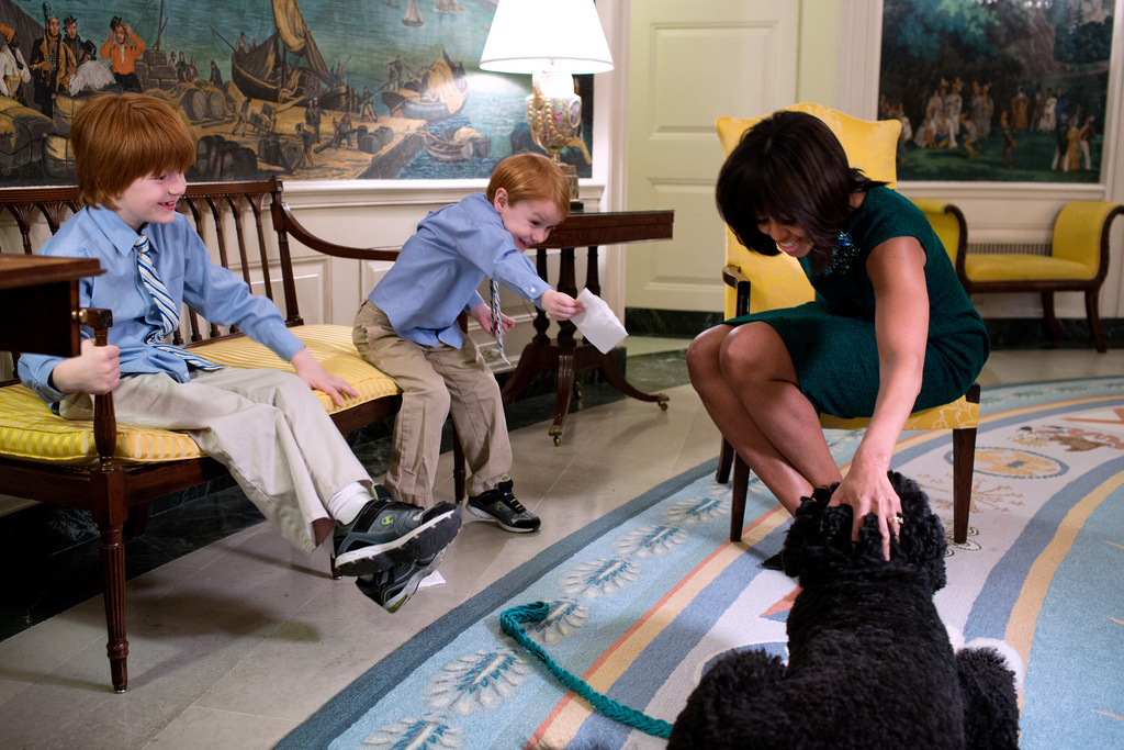 <p>First Lady Michelle Obama pets Bo, the Obama family dog, during a taping for &quot;The Ellen DeGeneres Show&quot; with 6-year-old Rainer Muuss, left, and his brother Atticus, 4, in the Diplomatic Reception Room of the White House, Feb. 7, 2013. (Official White House Photo by Chuck Kennedy)<br />
<br />
This official White House photograph is being made available only for publication by news organizations and/or for personal use printing by the subject(s) of the photograph. The photograph may not be manipulated in any way and may not be used in commercial or political materials, advertisements, emails, products, promotions that in any way suggests approval or endorsement of the President, the First Family, or the White House.</p>
