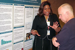 Intern Sutton presenting her poster at the Summers of Discovery Poster Session