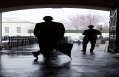 President Obama Waits For A Heavy Rain To Pass