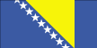 The Bosnia and Herzegovina flag is a wide medium blue vertical band, a yellow isosceles triangle, and a medium blue section with white stars diagonally along the hypotenuse of the triangle. 2003.