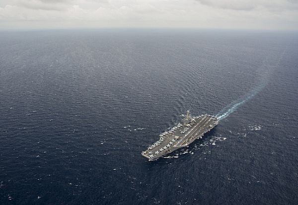 The forward-deployed aircraft carrier USS George Washington (CVN 73) and its embarked air wing, Carrier Air Wing (CVW) 5, are underway in the Philippine Sea. George Washington provides a combat-ready force that protects and defends the collective maritime interest of the U.S. and its allies and partners in the Indo-Asia-Pacific region.  U.S. Navy photo by Mass Communication Specialist 2nd Class Trevor Welsh (Released)  130929-N-ZS026-445