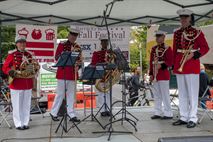 A brass quintette from the U.S. Marine Band performs during the Barracks Row Fall Festival on 8th St. SE, Washington, D.C., Sept. 28.
