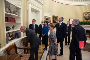 President Barack Obama points out several patent models while meeting with the 2013 American Nobel Laureates and their spouses in the Oval Office, Nov. 19, 2013. (Official White House Photo by Pete Souza)