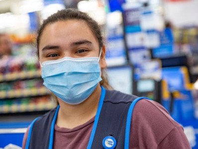 Woman wearing a surgical mask.