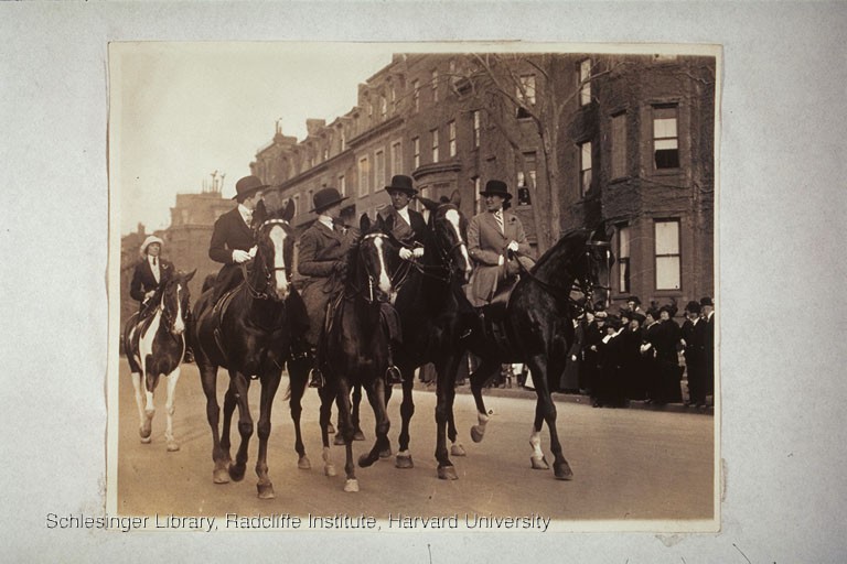 Women riding along Beacon St. in Boston on horseback in a suffrage parade, May 02, 1914.. 