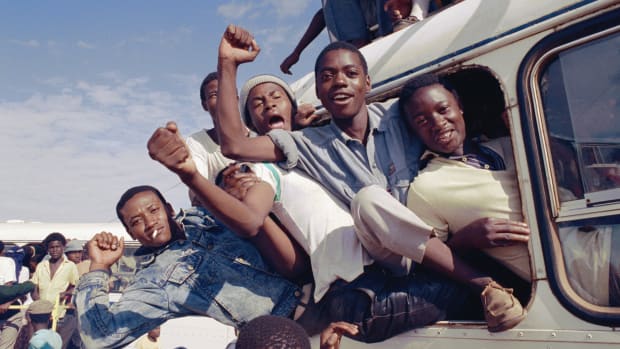 Key Steps That Led to End of Apartheid; South African men cheer and celebrate the news of Nelson Mandela's release from prison, 1990