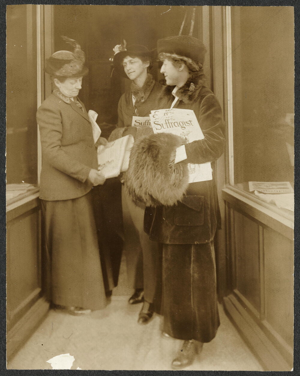  Rep. Jeanette Rankin of Montana (right) holding The Suffragist   newspaper  (    Library of Congress    )  