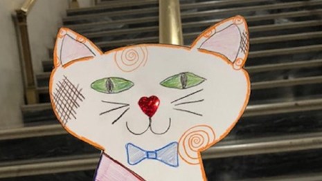 Image of a paper cat hand-colored. NPS photo.
