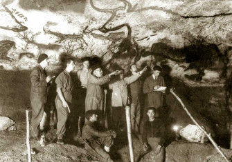 The cave’s discoverers with visitors (Marcel Ravidat, seated right, and Henri Breuil, centre), 1940.