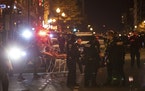 A member of the Proud Boys who was stabbed is taken to an ambulance in Washington, Dec. 12, 2020. (Victor J. Blue/The New York Times)