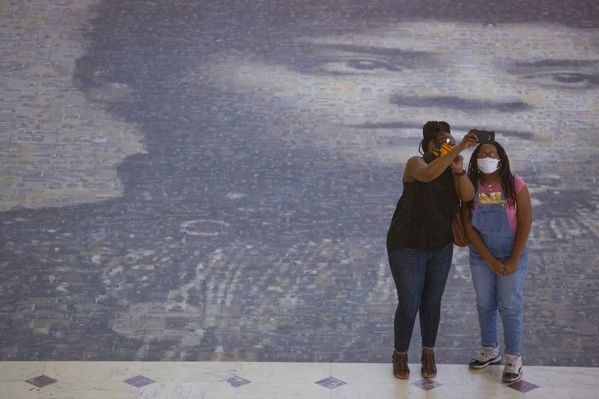 Women taking a selfie at Ida B. Wells Mosaic at Union Station in Washington DC
