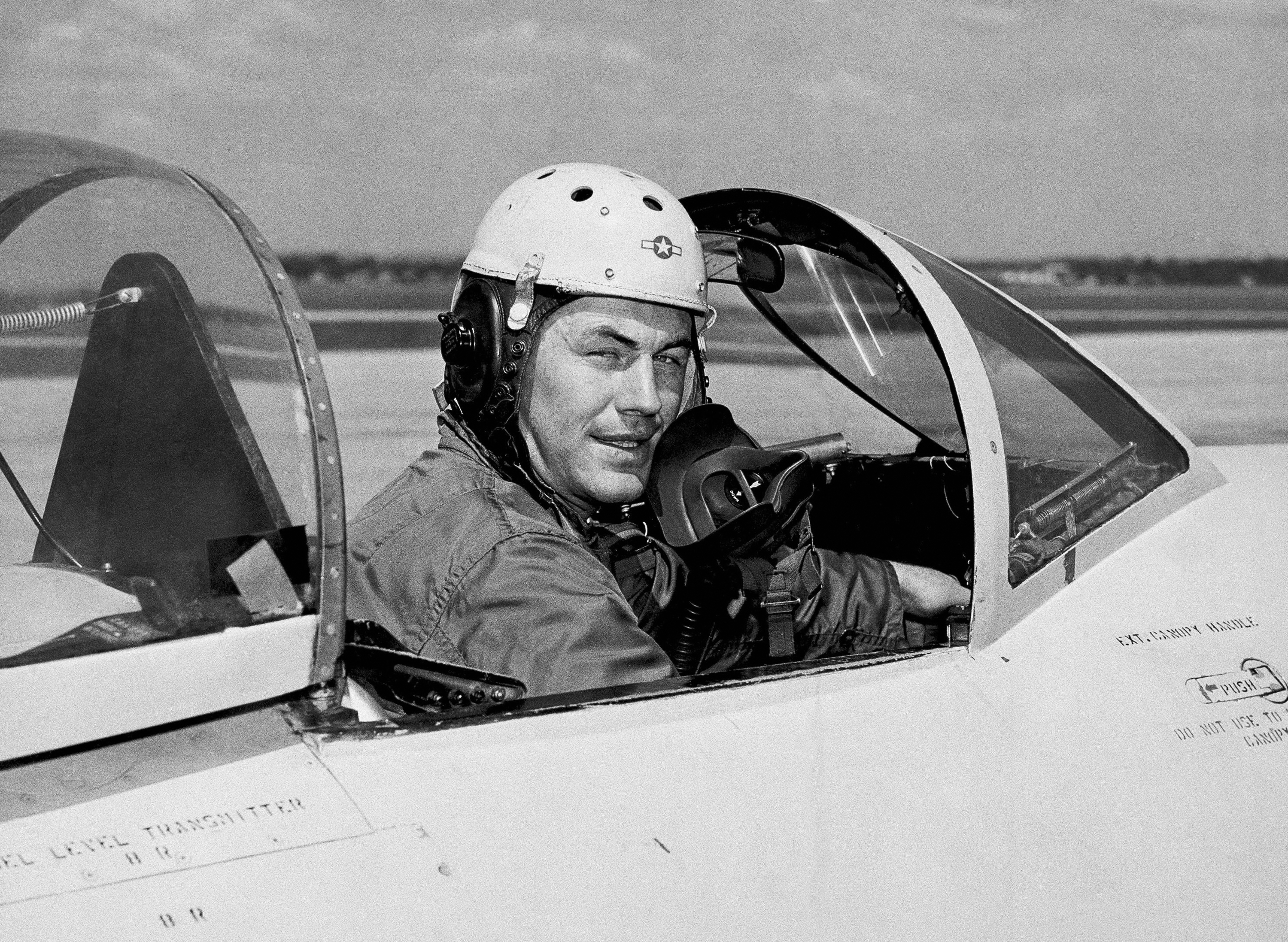 In this 1948 file photo, test pilot Charles  Chuck  Yeager, 25, poses for a picture in a jet's cockpit. Yeager was first to fly faster than the speed of sound. Another Yeager feat, flying a jet under a Charleston, W.Va., bridge in 1948, was not reported by the local media. Yeager died Monday, Dec. 7, 2020, at age 97.