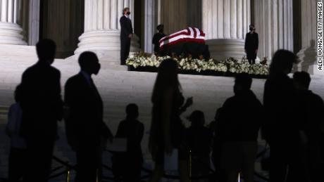 WASHINGTON, DC - SEPTEMBER 23: Members of the public pay respects to Associate Justice Ruth Bader Ginsburg as her flag-draped casket rests on the Lincoln catafalque on the west front of the U.S. Supreme Court September 23, 2020 in Washington, DC. A pioneering lawyer and according the Chief Justice John Roberts &#39;a jurist of historic stature,&#39; Ginsburg died September 18 at the age of 87 after a long battle against cancer.  (Photo by Alex Wong/Getty Images)