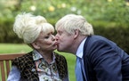 FILE - In this Sept. 2, 2019 file photo, British actress Barbra Windsor is kissed by British Prime Minister Boris Johnson, in 10 Downing Street, Londo
