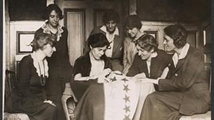 Party Activists watch founder Alice Paul sew a Star onto Ratification Flag
